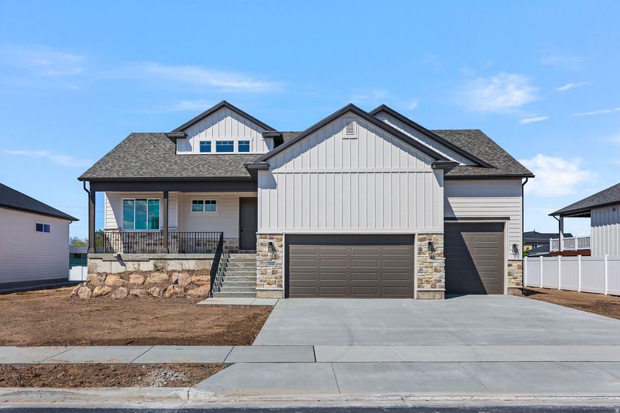 Custom Rambler with Main-Level Living & Loaded with Upgrades! Welcome to this beautiful custom rambler offering convenient main-level living and an open, inviting layout. The spacious master suite features a large bedroom, an incredible spa-like bathroom with an oversized garden tub, stunning walk-in shower, and an amazing walk-in closet. The super nice kitchen opens to a generous dining area-perfect for entertaining family and friends. Step outside to enjoy a large backyard with a covered patio and partially fenced yard, ideal for relaxing or gatherings. Located within walking distance to a brand-new elementary and junior high school, and just minutes from the new North Davis Corridor-commuting is a breeze. This home is packed with upgrades and will be ready March 1, 2026. Come and see! Finished pics are of the similar floor plan.