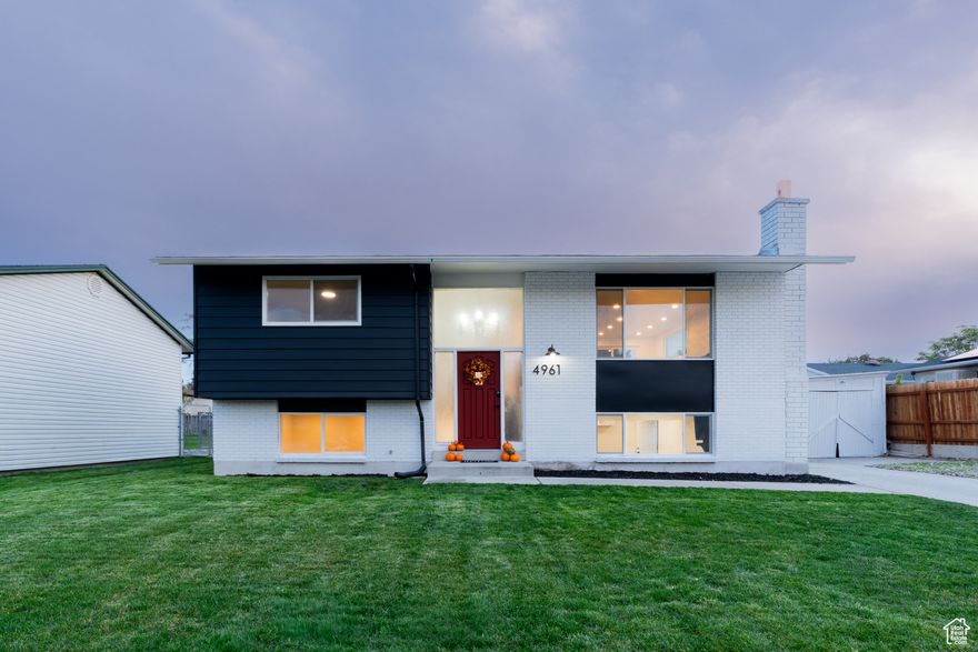 Santa came early this year, PRICE DROP on this beautifully remodeled home!   Step inside this stunning 4-bedroom, 2-bath split-entry home that's been completely remodeled with modern finishes, a full mother-in-law apartment, and a massive backyard with brand-new sod.  The walkout basement apartment features its own kitchen, bathroom, and laundry hookups-perfect for renting out to supplement your mortgage, hosting extended family, or creating a private guest suite.  Upstairs, you'll love the bright, open layout with brand-new flooring, soft-close cabinets, fresh tilework, and beautiful modern fixtures throughout. Both kitchens and bathrooms have been fully remodeled with today's design trends in mind, offering clean lines and timeless appeal. The home includes central air and a furnace for year-round comfort.  Step outside to a truly impressive backyard that feels like your own private retreat. The space is large, lush, and perfect for entertaining-featuring mature trees (including a tall pine and fruit tree), grapevines along the back fence, and a newly sodded lawn. A brand-new sprinkling system keeps everything looking its best. Whether you're hosting summer BBQs or enjoying a quiet evening outdoors, this backyard is built for relaxation and connection.  Located in a quiet, established neighborhood close to shopping, dining, schools, parks, and major roadways, this home offers both comfort and convenience. With every upgrade already complete, all that's left to do is move in and enjoy.  Whether you're searching for a move-in-ready family home or a smart investment property with rental income potential, this one truly checks all the boxes.  Schedule your showing today, homes like this don't come around often!  Owner is a licensed real estate agent. Buyer to verify all information. Square footage figures provided as a courtesy estimate only and were obtained from the county website. Buyer is advised to obtain an independent measurement.