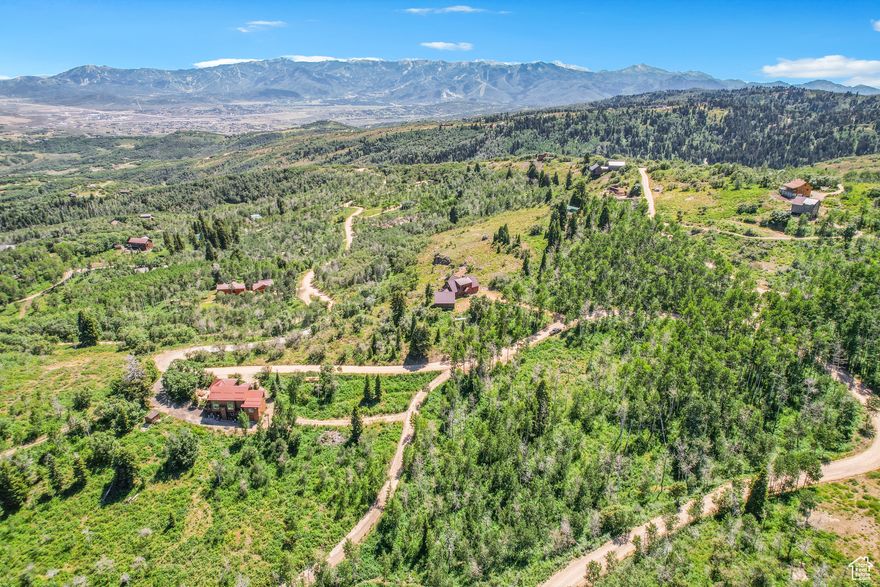 Beautiful Parcel of Land in a quickly developing area near Park City! Large aspen covered lot in Tollgate Canyon with over 3 acres to build your dream home! Only about 3 miles from I-80 on a well maintained road. With only 20 min away from ski resorts, shopping and restaurants you have the perfect mountain property with amenities close enough yet with a secluded distance!  Property is open land and available to look at. No appointment needed for showing. Year round access.  Flat Terrain, ready for building,  Electric is hooked up. Short term rentals are allowed!