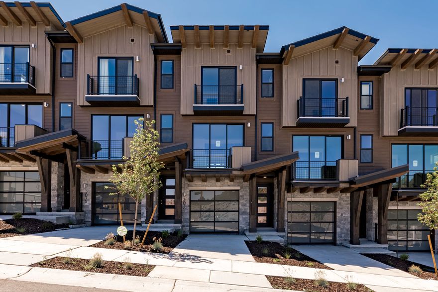 **This home has been reduced and the price reduction is considered an incentive.  The listed pricing is good with use of builder's preferred lender.  Please see sales associate for details on pricing as well as additional incentives if applicable.** Welcome to The Pointe at Current, where cutting-edge design meets mountain resort living! Nestled in the breathtaking Wasatch Mountains, between Park City and Heber City, this exceptional townhome offers a perfect balance of luxury and sustainability along the western shore of Jordanelle Reservoir. Enjoy easy access to premier hiking and biking trails, world-class skiing, snowboarding, and water recreation on Jordanelle Lake-your year-round playground. A private underpass under SB450 provides direct access to Deer Valley Resort, ensuring effortless exploration of all the area has to offer.  Built to meet the U.S. Department of Energy's Zero Energy Ready Homes standards, this home is designed with energy efficiency, health, and comfort in mind. With advanced insulation, solar-E windows, and energy-recirculation systems, it maximizes natural light and temperature control, while significantly reducing utility costs. Inside, you'll find stylish quartz countertops, custom cabinetry, and high-performance flooring, combining modern aesthetics with lasting durability. Step out onto your private balcony to savor the fresh mountain air, and unwind in one of the two primary suites on the third floor, including a spacious grand suite with a private outdoor retreat that immerses you in the stunning natural landscape.  With no HOA restrictions on nightly rentals, this home offers a fantastic opportunity for both personal enjoyment and potential rental income. Don't miss your chance to own a home that embodies the future of sustainable mountain living!