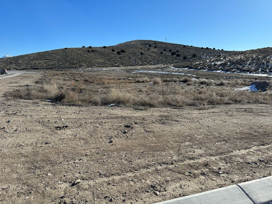 Deer Haven is a special area of large custom lots from 1 acres to 10 acres, located in The Ranches area of Eagle Mountain. Rarely do landowners, real estate developers, neighbors, special interest groups, and government officials collaborate together to create a community as special and unique as this one. Not only is this small yet distinctive community at the crossroads of a major deer migration corridor, it also provides refuge and feeding grounds for pronghorn and native bird populations (including quail, pheasant, and stunningly beautiful raptors), as well as many other smaller, furry, or flying friends! A conservation easement has been put in place to protect these animals and their habitats, affording you the uncommon opportunity to live peacefully among them; preserving their way of life while enjoying a front row seat to observe, commune, and bask in the beauties of nature. Bring your own builder. Other lots are available. Contact agent for more information. Owner/Broker.