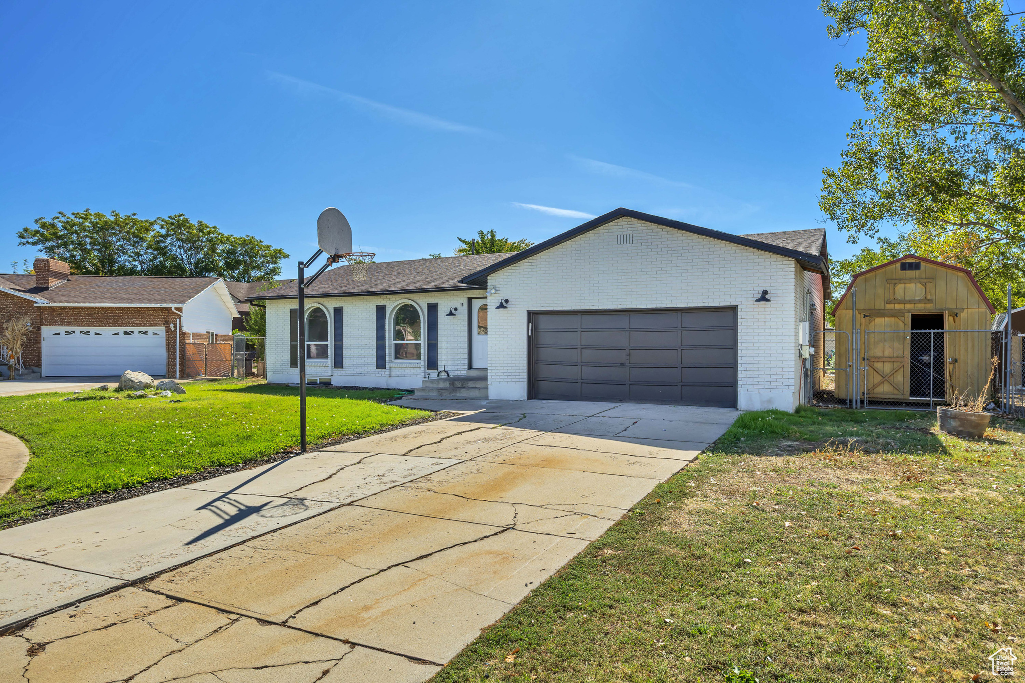 This beautifully updated farmhouse rambler features a high efficiency upgrade with all newer windows, paid-off solar panels, and a newer roof (2020). Recent renovations include updated plumbing, electrical, lighting, new carpet, and fresh paint throughout! The kitchen offers an open, inviting layout filled with natural light, featuring a stainless steel open basin sink and butcher block countertops. The spacious basement includes a walkout that provides excellent multi generational living potential! Outside, enjoy a large 14'x16' Trex deck that is perfect for entertaining! Outside there is a huge shed that's ideal for extra storage or as a small workshop. Conveniently located near restaurants, shopping, entertainment, Freeport Center, and Hill Air Force Base, this charming home is truly a must-see! VACANT AND EASY TO SHOW!