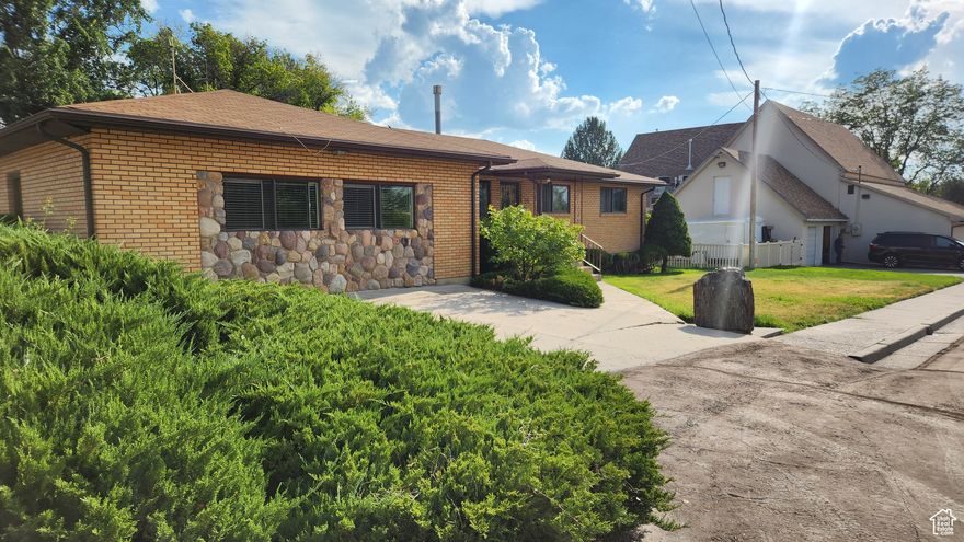 Well built home in 1966. Lot is beautiful, fully landscaped, next to creek. 2 HUGE garages will hold up to aprox 8 vehicles, toys, etc. Main level has some beautiful natural rock flooring, Living rm, kitchen & dining rm, 3 bdrms, 2 bths & includes 2 large recreation rooms, 1 with a gas fireplace & 1 with laundry hook ups. Basement has large utility room with laundry hook ups, gas radiant hot water heat furnace, water heater, soft water & lots of storage. Nice family room with fireplace & 2 bdrms along with cold storage. The property is private with lots of space for entertaining. Close to historic downtown, city pool, post office & city buildings This home is ready for some new carpet/flooring & your personal touches. Has original cabintry, appliances & some flooring. Possibilities are endless Carpet has been removed on main level. Back yard has a HUGE covered patio & small firepit all next to the Pleasant Creek.