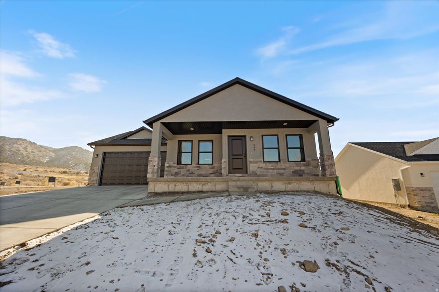 Welcome to this stunning brand-new construction home, at the perfect price point, positioned on a corner lot with beautiful mountain views enjoyed right from the front porch. Thoughtfully designed to be light, bright, and inviting, this home features an open layout. The upstairs showcases beautiful, unique finishes that set this home apart, offering both style and functionality for everyday living. The unfinished basement provides ample room to grow, ready for your future bedrooms, living space, or home gym-customize it to fit your needs.Complete with a 2-car garage and modern design details throughout, this home blends quality craftsmanship with timeless appeal. Enjoy the best of new construction living with space to expand.