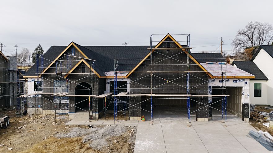 The Eleanor Rambler Floor Plan Experience luxurious main floor living with the beautifully designed Eleanor Rambler. This home features expansive common areas perfect for entertaining, with a spacious great room, kitchen, and dining area that seamlessly flow together. The gourmet kitchen is a chef's dream-outfitted with a commercial-grade gas range, built-in fridge/freezer combo, and ample counter space for culinary creations. Enjoy added privacy with a thoughtfully designed layout that places the master suite on the opposite side of the home from the additional bedrooms. The master retreat includes his and hers walk-in closets and a spa-inspired bathroom. Double deep 3rd car garage. Located next to Fox Hollow Golf Course. Completion at end of January 2026. Schedule your personal tour today. 20K preferred lender incentive.