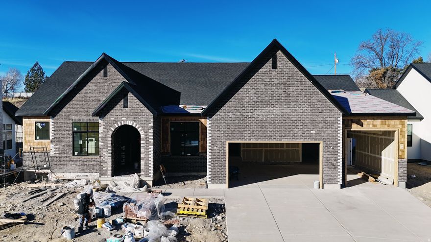 The Eleanor Rambler Floor Plan Experience luxurious main floor living with the beautifully designed Eleanor Rambler. This home features expansive common areas perfect for entertaining, with a spacious great room, kitchen, and dining area that seamlessly flow together. The gourmet kitchen is a chef's dream-outfitted with a commercial-grade gas range, built-in fridge/freezer combo, and ample counter space for culinary creations. Enjoy added privacy with a thoughtfully designed layout that places the master suite on the opposite side of the home from the additional bedrooms. The master retreat includes his and hers walk-in closets and a spa-inspired bathroom. Double deep 3rd car garage. Located next to Fox Hollow Golf Course. Completion at end of March 2026. Schedule your personal tour today. 20K preferred lender incentive.