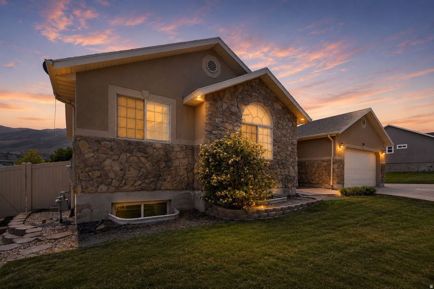 This beautiful 7-bedroom home in the heart of Saratoga Springs offers space, flexibility, and incredible views! Nestled in a quiet neighborhood with breathtaking mountain and Utah Lake views, this home is designed for comfortable living and effortless entertaining. The open-concept family room and kitchen create the perfect gathering space for family and friends, offering both functionality and warmth for everyday living and special occasions. The fully finished basement features a gorgeous wet bar with the potential to easily convert into a full kitchen, creating the perfect opportunity for an ADU, mother-in-law apartment, or additional living space. Upstairs and down, you'll find generous living areas with room for everyone. Step outside to a large backyard built for gathering and relaxation, complete with a spacious patio and cozy fire pit area-perfect for summer evenings and entertaining guests year-round. With its ideal combination of size, functionality, and location, this home is a rare find! Along with no HOA, solar panels are completely paid off! https://value-productions.aryeo.com/videos/019e2c08-b392-70b1-9e16-d9184f278f33