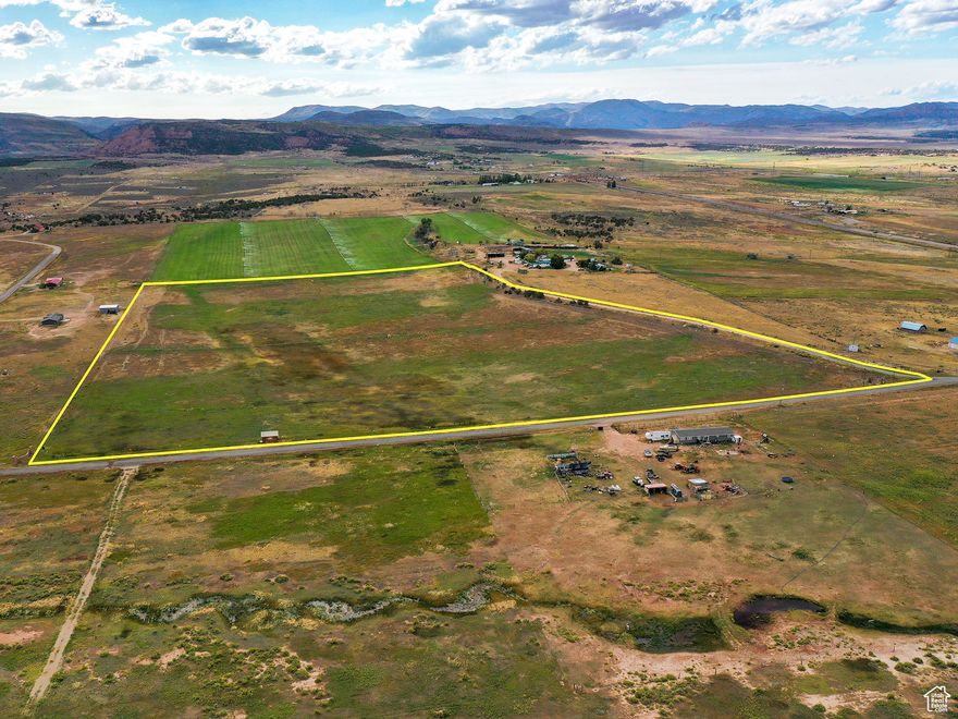 This property of 31.84 acres has year round access, and all utilities are available! You also have the option of drilling a well. The nearest well is less than 200ft deep and has great quality water.  If your ready to farm or pasture, you have pressurized irrigation with 70 Shares of Red Creek Irrigation water. Wheel lines are in good shape and system has been maintained by Mountain Land.  The last 3 years it has been pastured off. The last crop was 4 years ago and it was alfalfa. Production was about 2 crops a year at about 3tons per acre. If you were to put in a pivot, the potential of 3 crops increases. Landowner tags given every year, 2 Cow Elk 5 Doe Deer.  Located just south of Big G Station in Fruitland, so it is easy to find.  If you are looking for something to invest in for developing, this property is ready for it. The surrounding area have been subdivided so it would be the perfect finish for the surrounding area. The Uintah Basin is in dire need of more housing. You would not have any issue selling lots or homes.     Fruitland is located between Strawberry Res and Starvation Res. Perfect location for a get away cabin as well. Come make this place your own. https://youtu.be/pxURUeCm2y4