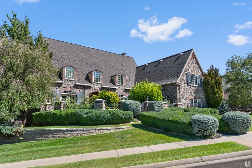 Exquisite European-style home on a fully landscaped corner lot with mountain views, private courtyard, gazebo nestled in scrub oak, and full-length back deck. Features 5 bedrooms, 4.5 bathrooms, main floor office with large windows overlooking backyard trees, finished basement with second full kitchen, grand formal dining room, hearth room, luxurious master suite with courtyard views, and spacious second-floor bonus room ideal for a playroom or bunk room. A sophisticated blend of elegance and mountain serenity.