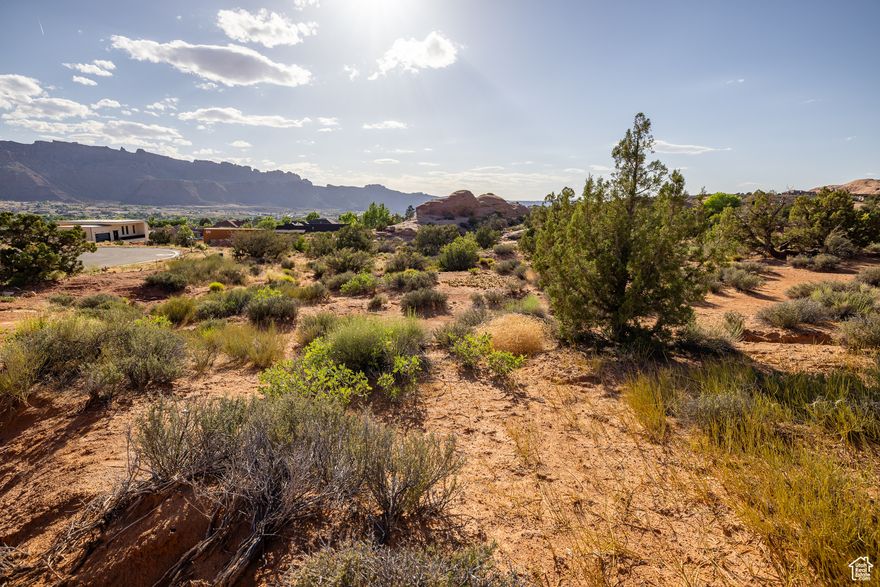 AMONG THE ROCKS  Exceptional 0.44-acre residential building lot tucked into Moab's iconic sandstone formations. Located in the serene and highly sought-after Puesta del Sol neighborhood, at the top of a cul-de-sac, this property offers the perfect balance of natural beauty and convenience with all utilities stubbed to the lot. Surrounded by dramatic red rock features and panoramic Moab desert views, seize a one-of-a-kind opportunity to build your dream home in some of Utah's most breathtaking landscapes. With easy access to the Moab Golf Club, world-class hiking, biking, and off-road trails, outdoor adventure is right at your future doorstep, all while being minutes from Moab's downtown shopping, local parks, and restaurants.