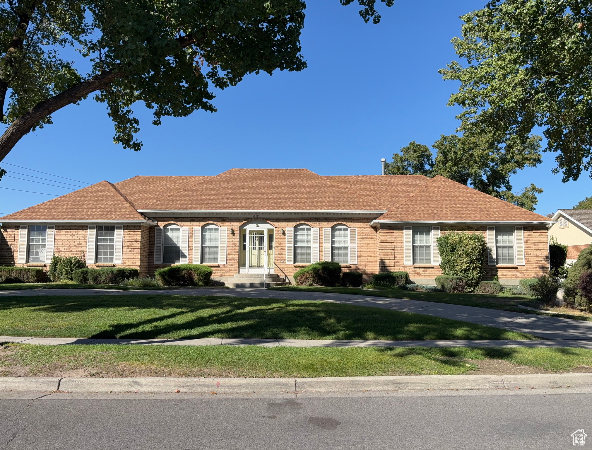 Beautiful all-brick home with abundant open spaces, 2 full kitchens, formal dining & breakfast nook, 2 family rooms. Curved driveway with ample parking, fenced landscaped yard, large deck & awning-perfect for entertaining inside and out.
