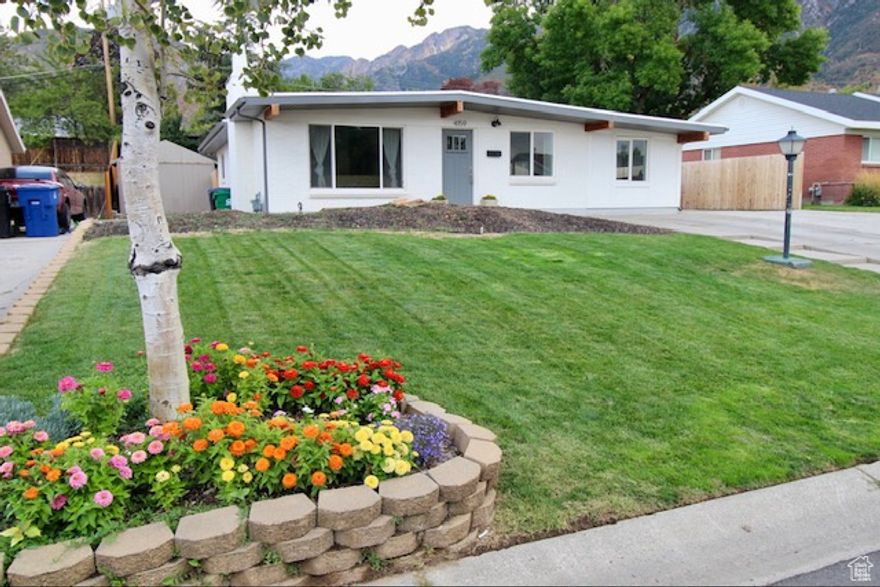 Discover the perfect balance of comfort and modern living in this beautifully updated Holladay home. Central, near canyons, and less than five minutes to free way access, this 5-bedroom, 3-bath residence offers both style and functionality.  Step inside to an inviting open floor plan, where vaulted ceilings create a bright and spacious atmosphere. The updated kitchen is the true centerpiece-complete with sleek countertops, modern appliances, and generous storage-seamlessly connecting to the living and dining areas for effortless entertaining.  Recent upgrades provide peace of mind, including a brand-new AC system (2023) and a new fence (2024), complementing the home's thoughtful updates throughout. Outside, the fully landscaped yard offers a private retreat ideal for gatherings, quiet evenings, or weekend relaxation.  Move-in ready and meticulously maintained, this Holladay gem invites you to simply settle in and start enjoying everything it has to offer-just minutes from mountain trails, parks, and all the charm of the surrounding community. Buyer/agent to verify all.