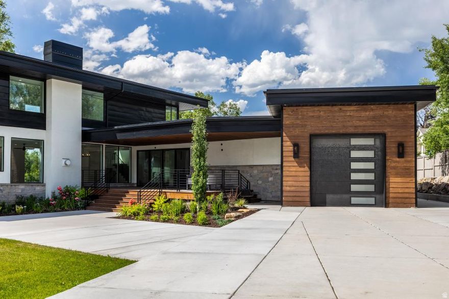 ** Priced $500k+ below recent appraisal.** Own the Lifestyle: A Modern Masterpiece at 1668 E Forest Hills Dr Step into a world of unparalleled luxury and effortless sophistication with this Parade of Homes stunner, completed in 2024 and redefining what it means to live well. Nestled in the sweet spot between Holladay and Millcreek, this 6,357+ sq. ft. private compound is your ultimate escape-a place to unwind, entertain, and command the moment. This isn't just a home; it's a vibe, a statement, a legacy. The Vision: From the moment you arrive, the sleek architecture and seamless indoor-outdoor flow grab you. Expansive picture windows frame jaw-dropping mountain views, flooding the open-concept living spaces with natural light. Every detail screams intentionality-modern luxury finishes, soaring vaulted ceilings, and covered terraces that beg for sunset cocktails or morning coffee. This is a home designed for how you live today-bold, connected, and always elevated. The Heart: The gourmet kitchen is a showstopper, anchored by a jaw-dropping quartz waterfall island that's as functional as it is Instagram-worthy. Commercial-grade appliances and eat-in seating make it the hub for everything from casual brunches to late-night gatherings. It's not just a kitchen; it's where memories are made. The Retreat: With five bedrooms and five-and-a-half baths, this estate is built for flexibility. The luxurious primary suite is your personal sanctuary, while two distinct bedroom wings offer privacy for family, guests, or that VIP houseguest you're dying to impress. Need more? An office, a theater room, and a bonus room with a wet bar and beverage cooler give you space to work, play, or just flex. The Playground: Step outside to 0.56 acres of pure possibility. The backyard's custom concrete pad is primed for pickleball action-ready to become your private court for epic matches or left as a versatile space for whatever fun you dream up. Add to that a sprawling grassy play area, a soothing water feature, and an outdoor sound system, and this backyard is your personal resort. Whether it's high-energy game days or chill evenings under the stars, this space delivers. Plus, two garages-a pull-through with extra parking and an oversized second-handle all your toys and then some. The Location: Tucked in Millcreek, you're minutes from everything-Salt Lake City's buzz, Park City's slopes, and the serenity of nature-all while feeling a world away in your private oasis. This is where convenience meets tranquility, with top schools (William Penn Elementary, Evergreen Middle, Olympus High) and a vibrant community at your doorstep. The Opportunity: This isn't just a home-it's a lifestyle upgrade. Perfect for the discerning buyer who wants it all: modern design, resort-style amenities, and a location that checks every box. Schedule your private tour today and experience the energy of 1668 E Forest Hills Dr. This is your moment-own it.