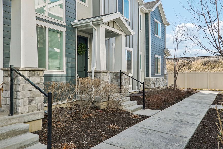 Welcome to this beautifully updated Bluffdale home offering modern comfort and everyday convenience. This 3-bedroom, 3-bathroom townhome features a thoughtfully designed living space with new LVP flooring, new carpet, newer appliances, and updated fixtures throughout.  The open living area is highlighted by a stylish built-in fireplace, creating a warm and inviting space for relaxing or entertaining. The spacious primary suite includes a walk-in closet, an oversized walk-in shower and double vanity sinks.  The built-in laundry room cabinetry adds extra functionality and storage as well.  The unfinished basement offers even more room to grow. Located in one of Bluffdale's most desirable neighborhoods with parks and schools within walking distance.  This move-in ready home offers the perfect blend of style, comfort, and convenience.  Preferred Lender providing 1% of loan amount towards one year rate buy down or closing costs. Call agent for details.