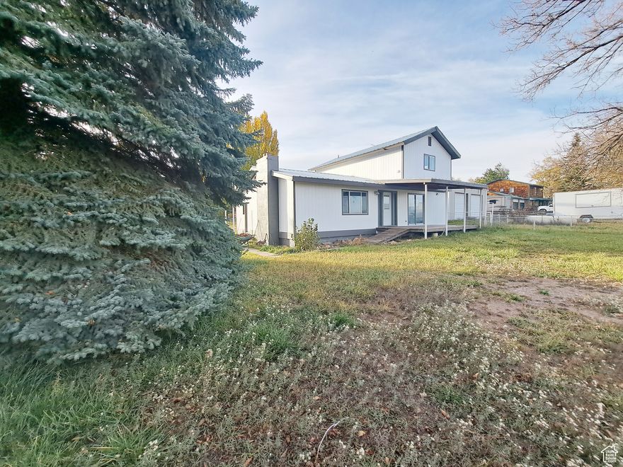 Completely Remodeled 4 Bedroom, 2 Bathrooms, on .6 of an acre.   ***Seller offering 2% interest rate buydown 1st yr. & 1% interest rate reduction for the 2nd yr. Qualified buyer could Save $453 a month 1st yr & $232 a month 2nd, Promo Available for qualified buyers!***  Contact Listing Agent for Details!*   Gorgeous Updated Kitchen with Butcher Block Countertops, New Luxury Vinyl Plank Flooring, New Carpet, New Bathroom Countertops, New Tile Surround Bathroom, New Exterior Paint, New Windows, Huge Shop. Huge Covered Patio. Room for LiveStock. RV Parking. Completely Fenced with Mature Trees. Irrigation Water .833 BIA shares. Amazing Views! Close to Mountains!