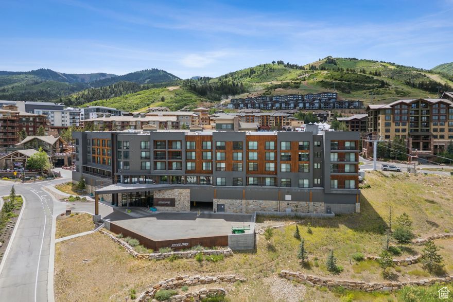 Discover this exceptional YotelPad in Canyons Village. Enjoy stunning eastern-facing views of the Uintah Mountains. Located in the heart of Canyons Village, you'll have easy access to dining, shopping, golf, skiing, hiking, and seasonal concerts. The smart European design features a queen Murphy bed, two bunks, and extensive storage throughout. The kitchen includes a two-burner cooktop, microwave, full refrigerator, and quartz countertops. This fully furnished unit includes a garage storage closet and one heated underground parking space. YotelPad amenities feature full concierge service, year-round pool and hot tub, equipment valet with boot drying and ski storage, laundry facilities, and indoor/outdoor gathering spaces. Modern conveniences like app-based snack ordering and contactless check-in make your stay effortless. Experience premium mountain living with these magnificent eastern mountain vistas.
