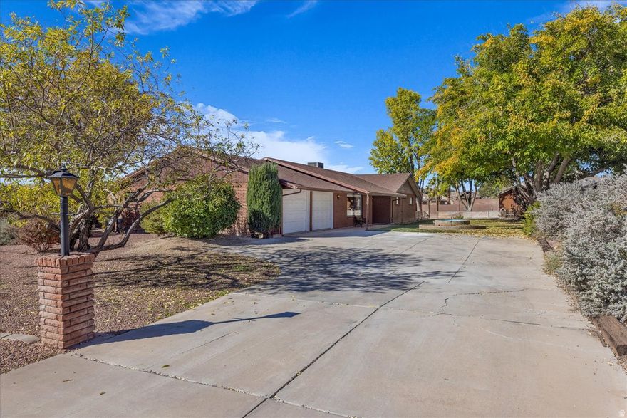 A bulkier than normal .64 acre lot, rectangular in shape and 100% usable in the west side of St. George known as Green Valley. All brick, all electric, no HOA. Living room size will exceed your expectations. Family rm., kitchen & dining open to each other. Sewing/Office/Den etc room in addition to 3 generous size bedrooms. Water heater recently replaced, interior recently repainted. Sure, with a home of this age, it's likely you'll want to remodel and put in your own finishing touches. At this price point, you have built in equity to increase the home value after your remodeling is done.