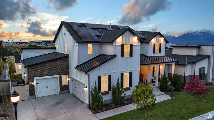 Step into this entertainer's dream home, where farmhouse charm meets industrial chic. Located in an exclusive gated community, this masterpiece is designed for comfort, functionality, and elevated living. A Smart Home with expansive open floor plan and soaring ceilings. Solar panels! Unobstructed city and mountain views! A standout oversized 3-car garage with four hydraulic storage lifts, custom workbenches, racks, and shelving - ohhh yeahhh! Customized from top to bottom, including the strategically designed landscaping. Don't miss the tiny home retreat out back, complete with electrical. (This is that home office/studio you've been looking for!)