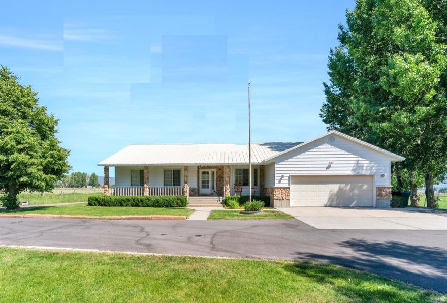 Ranch on 5 acres near Deer Creek Reservoir with barn, 3 kitchens including one in barn, 3/4 bath, basement apartment with private entrance, wood stove, new furnace, and optional water shares. Only 20 minutes from Provo.