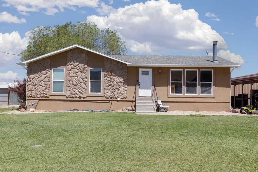 Welcome to this inviting 4-bedroom, 2-bath home in Monroe, Utah. Nestled on a spacious corner lot, it offers abundant parking including a convenient covered 2-car carport and plenty of off street space for vehicles, toys, and guests. Recently updated flooring and paint. Square footage to be determined by buyer.  - Just 2 miles from Monrovian Park for easy outdoor recreation - Only 2 minutes from the mountains for quick weekend adventures - A friendly, neighborhood feel with convenient access to local amenities  Interior highlights: - Two generous living rooms give you flexible space for entertaining, media, or play - Walk-in master closet adds a touch of luxury and extra storage - An extra storage room helps keep everything organized and clutter-free  Key features: - 4 bedrooms, 2 baths - 2-car carport - Corner lot  - Ample parking and storage options - Monroe, Utah location, close to parks and mountains  Open for viewing and ready for your personal touches. Schedule a showing today to see how this Monroe gem can fit your lifestyle. For more details or to book a tour Contact Tasia Duncan  435-201-2225   Seller is related to Agent.