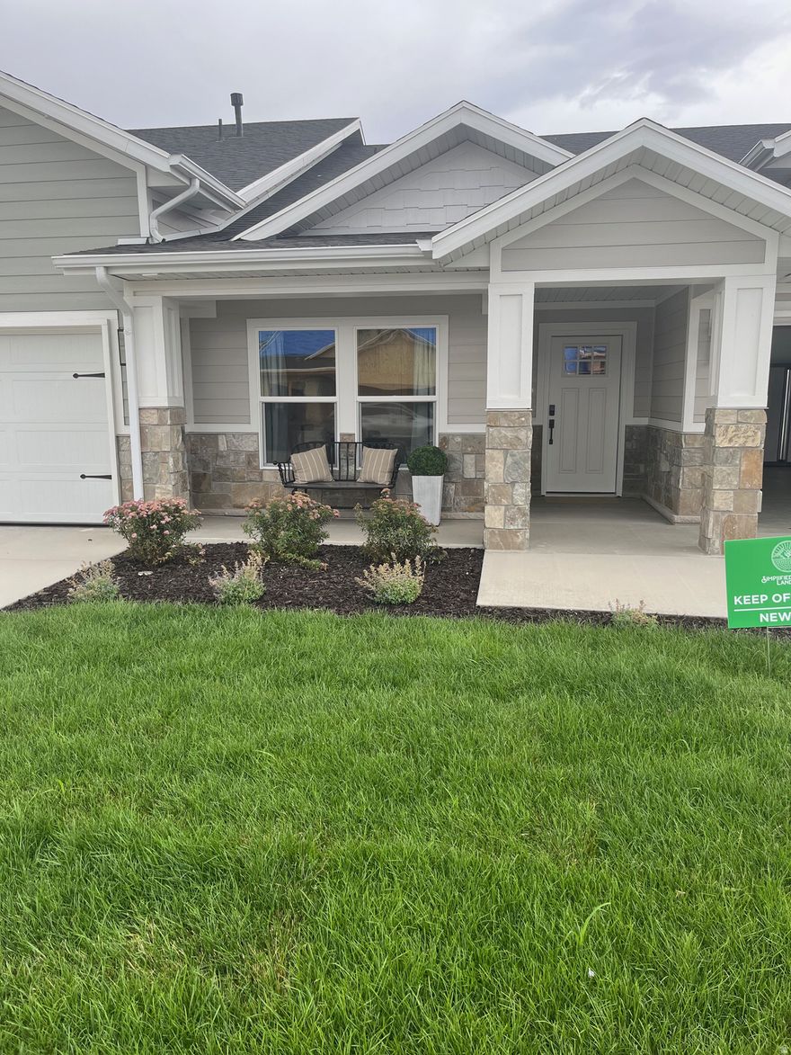 Experience Elevated 55+ Living with Ovation Homes in Syracuse!  Discover the perfect blend of style, comfort and connection in Northern Utah's premier active adult community.  This beautifully crafted, move-in ready single-level home offers upscale finishes, scenic mountain views and the lifestyle you've been waiting for.    Inside, you'll find a beautifully designed open-concept floor plan featuring two spacious bedrooms and a bright, inviting living area perfect for both everyday comfort and entertaining.  The kitchen truly shines with elegant quartz countertops, durable luxury vinyl plank (LVP) flooring, and quality finishes that blend style with practicality.  Large windows invite in natural light and frame stunning mountain views, creating a peaceful backdrop you'll enjoy year-round.  Step outside to your fully fenced backyard - ideal for relaxing evenings, morning beverages or gathering with friends while taking in the scenery.  Enjoy low-maintenance living in a vibrant 55+ community offering walking trails and pickleball courts that encourage connection, activity and fun.  Located in the heart of Syracuse, this home offers not just beautiful features - but a beautiful next chapter.  Elevated finishes.  Scenic views.  Exceptional community.  This is 55+ living at its finest.