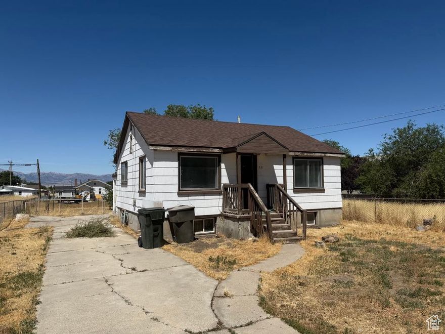 **Great Investment Opportunity in Tooele!**  Discover the potential in this charming 4-bedroom home, ideally located within walking distance to local shops, restaurants, and amenities. With a spacious, open-concept kitchen and living areas, this property offers the perfect canvas for your personal touch.  While the home could use a little TLC, the possibilities are endless-whether you're looking to renovate and flip, create your home, or add a valuable rental property to your portfolio.  Don't miss your chance to own in this neighborhood at a great price. Schedule your showing today!