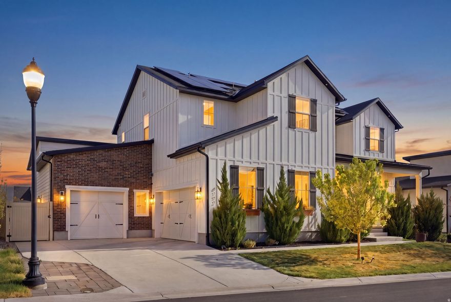 Receive a 1% credit towards closing costs or a rate buy down when using preferred Lender!! Welcome to this modern farmhouse in the gated community of Juniper Bend, where beautiful design meets an active, low-maintenance lifestyle. With soaring ceilings, walls of windows, and beautiful views of Salt Lake Valley, this home was built to impress. The main level is designed for both everyday living and entertaining, featuring a chef's kitchen with Sub-Zero and Wolf appliances, a striking black pantry door, and a massive quartz island that anchors the space. Tucked behind a hidden bookshelf, the private primary suite offers a spa-like retreat with designer finishes. Upstairs you'll find a bright loft, three spacious bedrooms, and a laundry room with a built-in dog wash station. The fully-finished basement is built for entertaining, offering flexible space for movie nights, games, or hosting- plus a hidden door leading to your private gym and additional storage. Step outside to a professionally landscaped backyard with a powered custom tiny home-perfect for guests, creative space, or your next hobby! Additional features include solar panels, smart home tech, and an oversized 3-car garage with hydraulic storage lifts and dedicated workspaces.