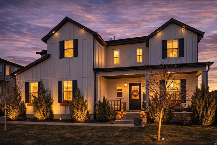 Welcome to a home that knows how to have fun and look good doing it. Nestled in a beautiful gated community, this modern farmhouse stuns with soaring ceilings, walls of windows, and breathtaking Salt Lake Valley views. The main level flows effortlessly from a chef's kitchen-complete with Sub-Zero and Wolf appliances, a bold black pantry door, and a massive quartz island perfect for gatherings-to a warm, inviting living space. Behind a hidden bookshelf, the private primary suite offers a spa-like retreat with designer finishes. Upstairs features a bright loft, three spacious bedrooms, and a laundry room with a built-in dog wash station. Downstairs is an entertainer's dream! A spacious, versatile area for movie nights, games, or hosting friends, plus a secret door to your private gym with even more storage space. Outside, the professionally landscaped backyard includes a recessed patio and a powered custom tiny home retreat-perfect for guests, creative space, or your next hobby. Solar panels, smart home tech, and an oversized 3-car garage with hydraulic storage lifts and workspaces round out this stunning, functional, and stylish Herriman gem.