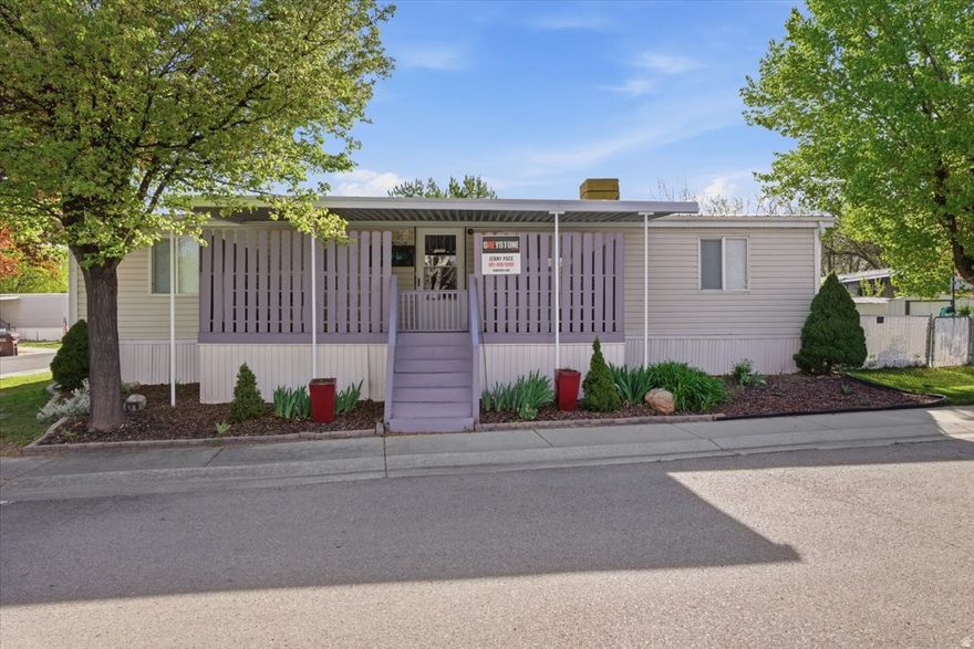 Affordable living in the heart of Sandy with unbeatable convenience and community amenities!  This spacious 3-bedroom, 2-bath double wide offers 1,152 sq ft of comfortable living space with a functional layout and multiple areas for relaxing or entertaining. The home features an updated kitchen, a refreshed primary bathroom with garden tub and tile surround, and two decks-perfect for enjoying the outdoors. Refrigerator is included.  Major updates include a roof replaced in 2021 and a water heater replaced in 2018. The home is equipped with a swamp cooler for A/C and offers comfortable, efficient living.  Step outside to a fully fenced yard with room for pets, gardening, or outdoor gatherings, plus two storage sheds for added convenience. With parking for up to 3 vehicles, this property offers flexibility and ease.  Located in a well-maintained community featuring a clubhouse, pool, and playground, and just minutes from shopping, dining, TRAX, I-15, hiking trails, and world-class skiing.  A great opportunity to own in a prime Sandy location at an affordable price!