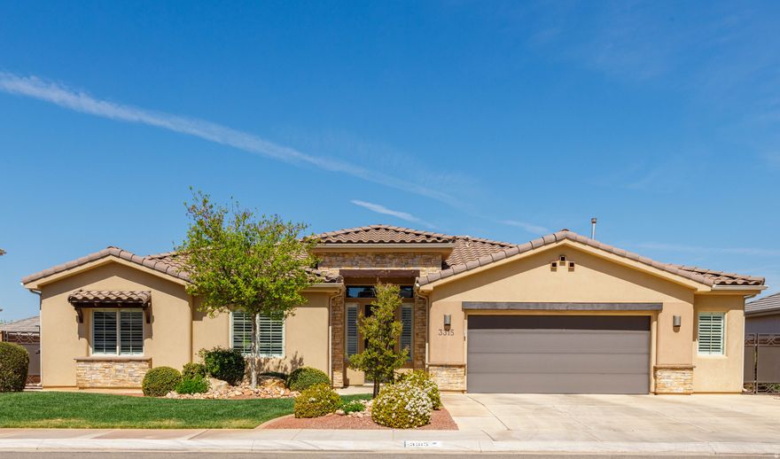 In the heart of highly sought after Little Valley, this immaculate Ence-built retreat offers refined living with over $85,000 in premium upgrades. This move-in-ready oasis features stunning wood-plank tile flooring, elegant under-cabinet lighting, and whole-home surge protection. The gourmet kitchen is a showstopper, boasting luxurious marble countertops, a gas range, and built-in gas wall oven & microwave. Experience ultimate comfort with premium thick carpet/pad, front plantation shutters, and privacy-enhancing rain glass. Enjoy pristine water quality via the Triton whole-home water system. The garage is a hobbyist's dream with a urethane floor coating and ample built-in cabinetry. Outside, professional lush landscaping and a luxurious extended pergola create a serene private escape. Bonus: Washer, dryer, refrigerator, and furniture sets for the primary suite, dining room, and patio are all included! Don't miss this turn-key luxury home in St. George's most sought-after community.