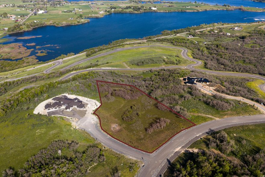 Welcome to your dream homesite in the heart of Eden UT. This exceptional 5.43-acre ranch lot is tucked within the sought-after Osprey Ranch community, where expansive views and peaceful mountain living come together. Perched along a scenic ridge, the property offers breathtaking panoramic views of Ogden Valley, with direct sightlines to Pineview Reservoir and the surrounding alpine peaks. Set in a thoughtfully planned community that balances open space, natural beauty, and privacy, this lot provides the ideal canvas for your custom mountain retreat. Whether you're soaking in the sunrise over the valley or watching the sunset behind the mountains, every direction delivers a postcard-worthy view. Recreation abounds in every season. Nordic Valley is just 4 miles away, Powder Mountain is 8.5 miles, and Snowbasin Resort is only 13.5 miles from your doorstep. Downtown Ogden, with its restaurants, shopping, and historic charm, is an easy and scenic 20-minute drive. To truly appreciate the full 360-degree views and unique setting of this property, visit: https://www.osprey-ranch.com/ranch. Boundary lines are provided as a courtesy estimate only. Buyer is advised to obtain an independent measurement.