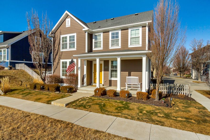 Impeccably maintained home in Daybreak's North Shore community with stunning mountain views. Enjoy the covered front porch, open floor plan, and sun-filled great room with large windows. The kitchen features granite countertops, a breakfast bar, ample cabinetry, and stainless steel appliances with a gas range. Dining area opens to a fully fenced backyard with paver patio-perfect for grilling. Spacious primary suite includes a walk-in closet and ensuite bath. Finished basement family room offers additional space for entertaining. Ideally located near Oquirrh Lake, parks, splash pad, shopping, dining, Trax, and all Daybreak amenities including pools, gym, and year-round activities. A must-see!
