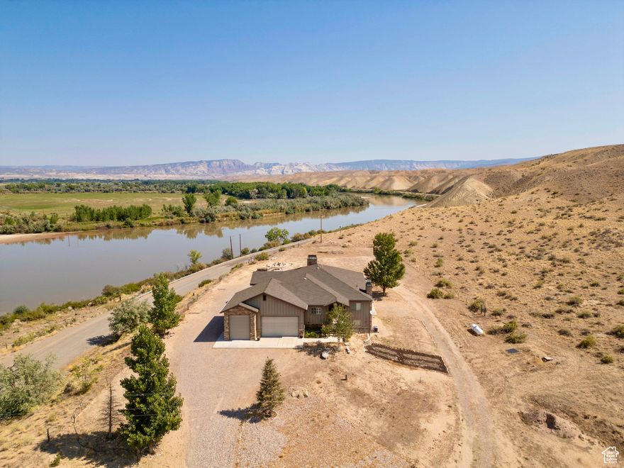 Price Improvement!! Gain instant equity with this spacious dream that  home overlooks Green River and sits adjacent to the BLM, offering unparalleled access to nature and outdoor adventures!!  Just 2 miles from a gravel river boat ramp, this home is a paradise for river enthusiasts, atv's, horse lovers, etc. The spacious layout also features a beautiful 1500 sqft mother-in-law apartment in the basement providing privacy and convenience for guests, family, or rental opportunities. Don't miss the opportunity to own this gorgeous home in a picturesque landscape  Square footage figures are provided as a courtesy estimate only and were obtained from seller.  Buyer is advised to obtain an independent measurement.