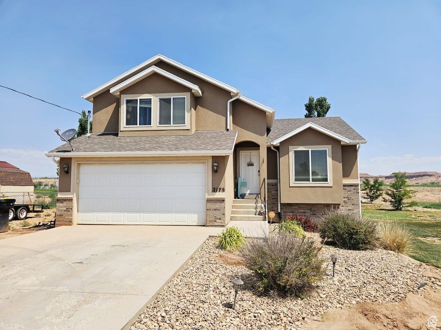 Built in 2014, this 2059 sq ft tri-level home offers modern comfort on a spacious 0.68-acre lot. Featuring 3 bedrooms and 2 bathrooms, the primary bedroom and a second bathroom are conveniently located on the second story with the remaining two bedrooms. Enjoy granite countertops throughout, stainless steel appliances, and stylish two-tone paint. The property includes an unfinished basement, ready for your customization, and an attached two-car garage. Located on 1000 N, this home is equipped with public culinary water, public sewer, Moonlake Electric, and Enbridge natural gas. All furniture is available and can be purchased separately with the sale of the home.