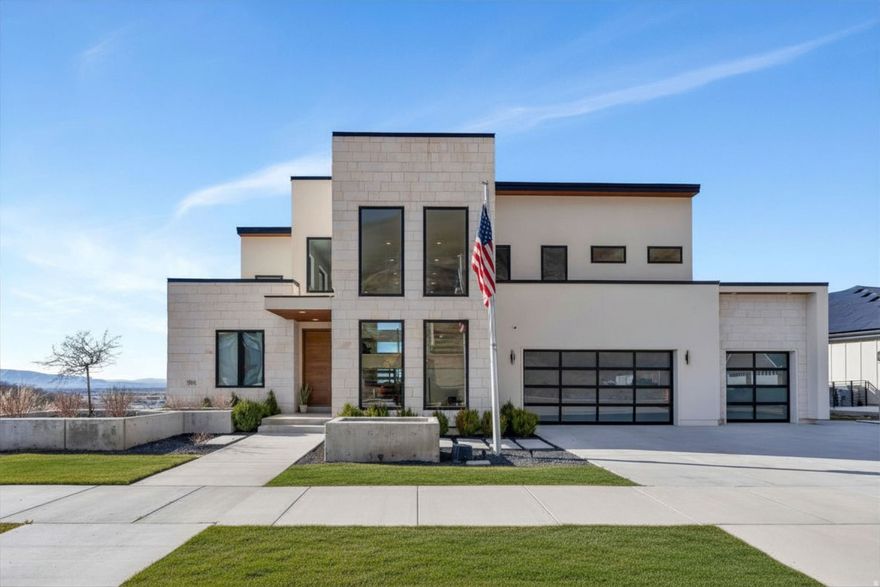 Experience elevated living in this stunning Mapleton estate, where sweeping panoramic views and dramatic two-story windows in the great room frame the mountains and valley like a painting! The spacious family room is ideal for hosting guests with it's expansive 19' ceilings, chic built-in fireplace and expansive windows allowing for abundant natural lighting. Gorgeous, light-colored flooring coasts to the modern Kitchen showcasing lovely accent slab Oak cabinetry, gorgeous Quartz tops, an expansive island with a built-in sink and more! The primary suite offers a true retreat with an oversized walk-in closet and a spa-inspired bath featuring a walk-in shower and soaker tub combo. Downstairs you'll find a spacious Family Room with a dry bar and several daylight walkouts accessing the gorgeous yard. Multiple balconies invite you to take in the breathtaking scenery from every angle, while the backyard is designed for unforgettable entertaining with an in-ground trampoline, outdoor kitchen, and inviting lounge space complete with a swinging bed. This is a rare opportunity to own a home that blends luxury, comfort, and unforgettable views in one exceptional setting! Schedule a showing and come tour this beautiful home today!