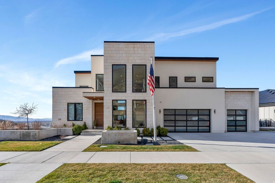 Experience elevated living in this stunning Mapleton estate, where sweeping panoramic views and dramatic two-story windows in the great room frame the mountains and valley like a painting! The spacious family room is ideal for hosting guests with it's expansive 19' ceilings, chic built-in fireplace and expansive windows allowing for abundant natural lighting. Gorgeous, light-colored flooring coasts to the modern Kitchen showcasing lovely accent slab Oak cabinetry, gorgeous Quartz tops, an expansive island with a built-in sink and more! The primary suite offers a true retreat with an oversized walk-in closet and a spa-inspired bath featuring a walk-in shower and soaker tub combo. Downstairs you'll find a spacious Family Room with a dry bar and several daylight walkouts accessing the gorgeous yard. Multiple balconies invite you to take in the breathtaking scenery from every angle, while the backyard is designed for unforgettable entertaining with an in-ground trampoline, outdoor kitchen, and inviting lounge space complete with a swinging bed. This is a rare opportunity to own a home that blends luxury, comfort, and unforgettable views in one exceptional setting! Schedule a showing and come tour this beautiful home today!