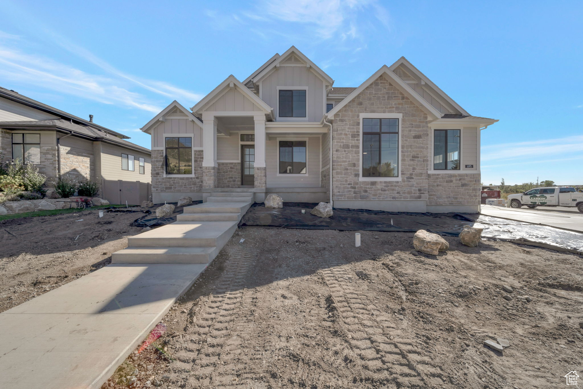 LOT#1 Hidden Farm Estates by Symphony Homes, showcasing the elegant Craftsman-style Accord plan (. This stunning two-story home is filled with luxurious designer touches-from custom millwork in the flex room and a striking above-mantle wall feature, to the built-in mudroom bench with hooks. The spacious kitchen is a chef's dream with double wall ovens, a gas cooktop, and a butler's pantry. Enjoy the soaring two-story entry and family room, and step out onto the covered deck off the dining nook. The home includes two laundry rooms, a primary closet with a custom butler system, and walk-in closets in every upstairs bedroom. The finished basement features a large game room with a wet bar, 9' foundation walls, generous storage space, an entrance to/from the backyard, and an active radon mitigation system for peace of mind. Full landscaping is included in the price and is already in process to be completed in October.