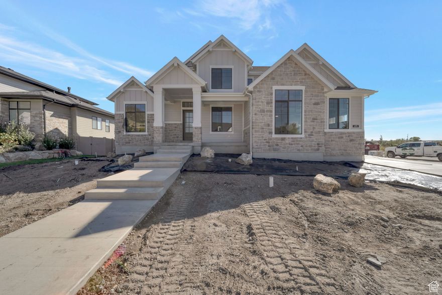 LOT#1 Hidden Farm Estates by Symphony Homes, showcasing the elegant Craftsman-style Accord plan (. This stunning two-story home is filled with luxurious designer touches-from custom millwork in the flex room and a striking above-mantle wall feature, to the built-in mudroom bench with hooks. The spacious kitchen is a chef's dream with double wall ovens, a gas cooktop, and a butler's pantry. Enjoy the soaring two-story entry and family room, and step out onto the covered deck off the dining nook. The home includes two laundry rooms, a primary closet with a custom butler system, and walk-in closets in every upstairs bedroom. The finished basement features a large game room with a wet bar, 9' foundation walls, generous storage space, an entrance to/from the backyard, and an active radon mitigation system for peace of mind. Full landscaping is included in the price and is already in process to be completed in October.