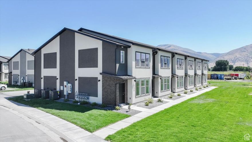 Brand New End-Unit Townhome with Mountain Views! This 3 bed, 2.5 bath home features a spacious kitchen with pantry and oversized island, plus a bright primary suite with 7 windows, large bath, and walk-in closet. Located in Nibley Meadows with unobstructed Wellsville Mountain views and a new city park coming right across the street. Now selling our last units! Schedule a showing today!