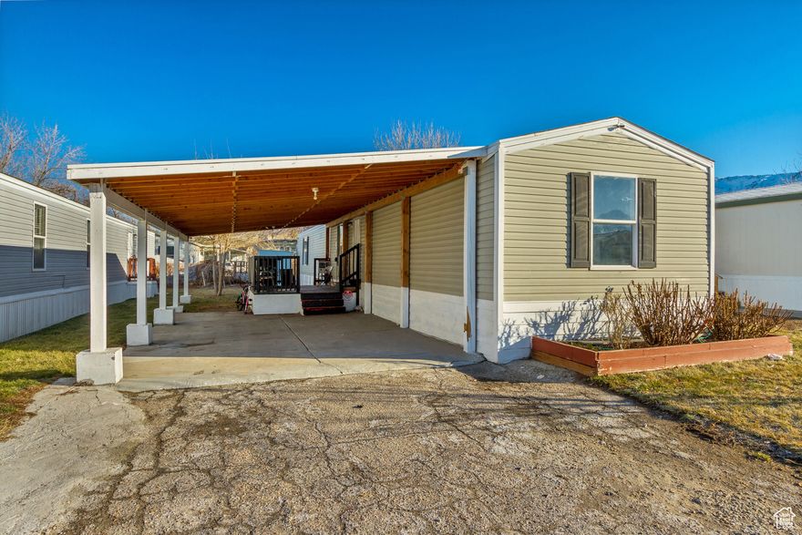 NEW IMPROVED PRICING!!! Discover comfort and convenience in this newly refreshed mobile home in the heart of Pleasant View. One of the only with 4 bedrooms and 2 bathrooms in the neighborhood! Updated kitchen, flooring and paint,  and new covered parking for 2 cars! Enjoy easy access to Highway 89 for quick commutes to Ogden and Salt Lake City. The community is peaceful and family-friendly, with nearby outdoor activities, parks, shopping, and dining options. Ideal for those seeking a quiet home with great access to nature and city life. Square footage figures are provided as a courtesy estimate only and were obtained from seller. Buyer is advised to obtain an independent measurement.