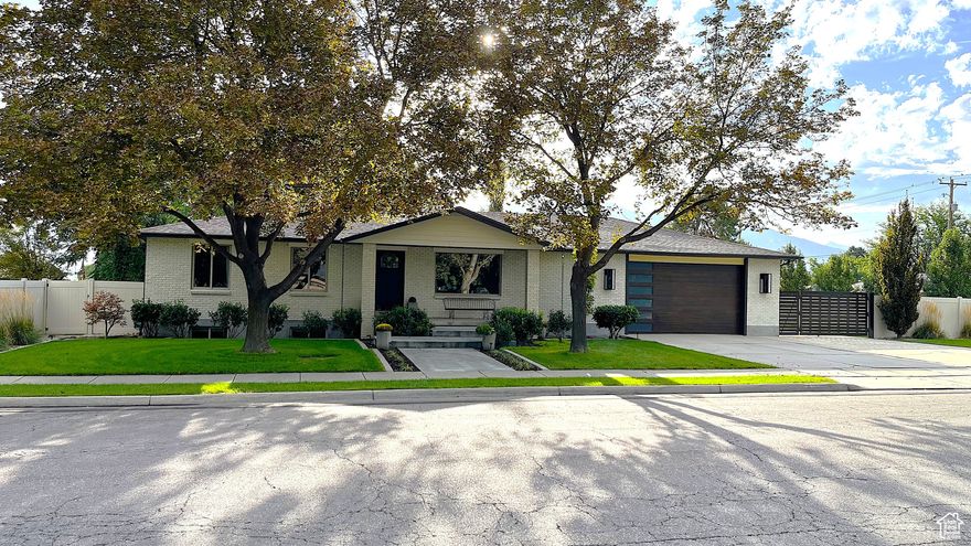 Modern Luxury Meets Classic Charm with this Stunning Fully Renovated Ranch Rambler Home Experience the best of both worlds in this beautifully renovated ranch-style home, inspired by Restoration Hardware and designed for effortless modern living. The open 21st-century floor plan flows seamlessly from one space to the next, creating an inviting environment for family and entertaining.   Main Floor: Enjoy a spacious, character-rich kitchen featuring marble countertops, a large 8' island that comfortably seats seven with a sleek stainless/tempered glass countertop. Alder cabinets with dovetail drawers, stainless steel Frigidaire professional fridge and freezer, gas stove. The large primary suite boasts hanging crystal pendants, a luxurious soaking tub, a marble countertop, and a walk-in closet.   Basement: Fully renovated and filled with natural light thanks to oversized sloped window wells. Perfect for rental or extended family living. Features include a large kitchen, semi-formal dining area (or game space), separate laundry, and a spacious family room ideal for a playroom or movie nights. Three bedrooms, including a private primary suite with a large walk-in shower, offer comfort and privacy. The separate 8' wide covered entrance makes moving in a breeze.   Outdoor Oasis: The backyard is designed for relaxation and fun, with mature trees, established landscaping, automatic sprinklers, and a drip irrigation system. Entertain on the expansive wood deck, fully shaded by a beautiful apricot tree, or gather around the gas fireplace or sunken firepit. A large concrete pad is perfect for chalk art, and the park-like yard is ideal for playing and hosting guests.  This exceptional home offers flexible spaces perfect for families, entertaining, or generating rental income. Don't miss your chance to own a move-in ready property that combines sophisticated updates with timeless appeal.