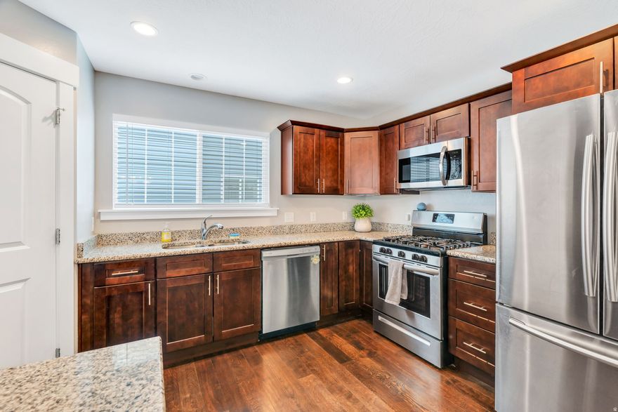 Better than new and move-in ready! This beautifully maintained 3-bedroom, 2.5-bath home in the heart of Eagle Mountain offers modern finishes, functional living space, and low-maintenance living.  The open-concept main level features a bright and inviting living area, spacious dining space, and a well-appointed kitchen complete with solid surface countertops, ample cabinetry, and a large island perfect for entertaining. Upstairs you'll find a generous primary suite with private ensuite bath and walk-in closet, along with two additional bedrooms, a full bath, and convenient upstairs laundry.  The unfinished basement provides room to grow and customize-ideal for adding an additional bedroom, bathroom, or family room. Enjoy the fully fenced yard, patio space, and attached 2-car garage.  Located near parks, schools, shopping, and commuter routes, this home combines comfort, convenience, and value.