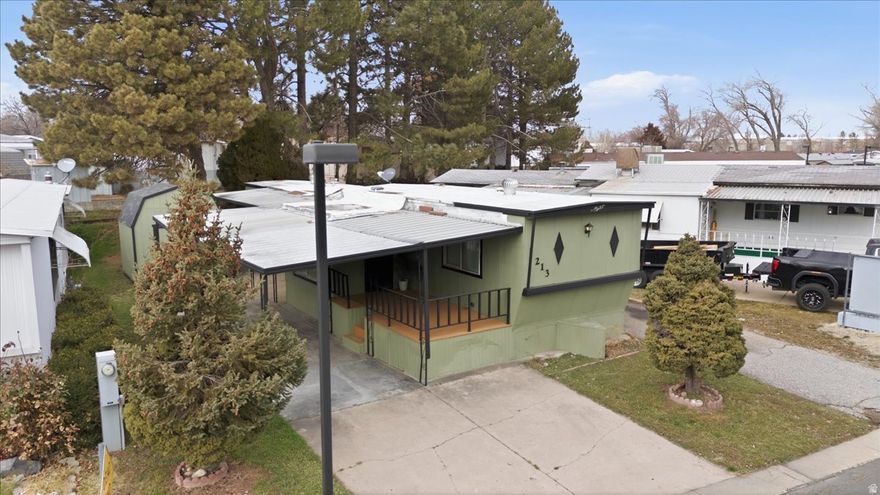 This cozy mobile home is tucked inside a well-maintained, welcoming park and offers a fun, thoughtfully designed layout that makes the most of every space. Fresh new interior paint brightens the home, while brand-new flooring adds a clean, modern touch throughout.  The layout feels cozy and inviting, with comfortable living areas that flow naturally into one another-perfect for relaxing, entertaining, or simply enjoying everyday living. Natural light fills the home, enhancing its warm, cheerful atmosphere and highlighting the updated finishes.  Whether you're looking for a low-maintenance lifestyle or a charming place to call home, this move-in-ready mobile home combines comfort, style, and convenience in a community that's clearly been cared for