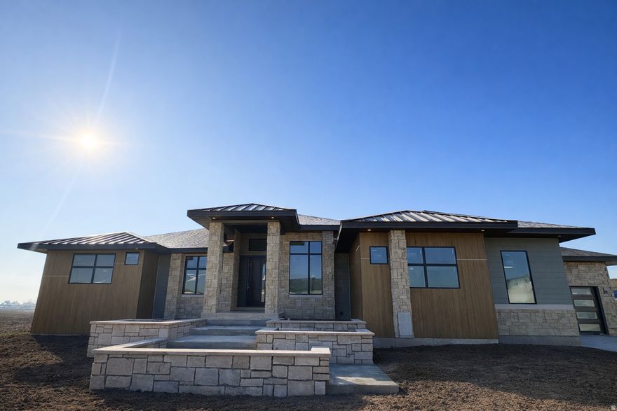 Lot 513 in Chestnut Farms, by Symphony Homes. The Adagio plan (Estimated completion April 2026). This thoughtfully designed home features a luxurious main-floor primary suite with tray ceiling and custom millwork, a cozy sitting area with fireplace, a spa-style bath, and a spacious walk-in closet with a custom closet butler system and stackable laundry. Both a flex room and an office greet you at the entry before opening into the impressive great room. The kitchen is beautifully appointed with KitchenAid appliances, built-in column fridge and freezer, a large butler pantry, and a convenient pocket office. The dining nook flows seamlessly to the covered deck, creating an ideal indoor/outdoor living space. The fully finished basement offers three additional bedrooms, two bathrooms, a large laundry room, an open game room, a wet bar, and walk-out access to the covered patio. Additional features include a cold cellar, active radon mitigation system, and a 4-car garage.  A stunning blend of craftsmanship and comfort-don't miss this one.