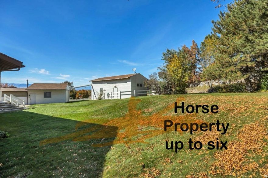 Open House 11/21 11am-1pm Location, Location, Location! If you're looking for a property that can accomodate horses, this is the one. Nestled on a spacious corner lot with sweeping valley views, this timeless property offers endless possibilities for those with an eye for potential and a heart for home. An open great room welcomes gatherings both big and small, flowing naturally into an updated kitchen featuring solid wood cabinets, beautifully crafted and built to last. A light-filled over-garage sunroom with windows on three sides frame the stunning panorama views. Every bedroom is generously sized. Downstairs, a spacious two-bedroom apartment (ADU) offers a separate kitchen, a spacious family room, and its own entrance, ideal for guests, extended family, or rental income. There's even a large unfinished storage room ready to be customized to fit your needs. For the hobbyist or entrepreneur, the huge, detached two car garage and workshop with ample storage is a dream come true. Whether it's woodworking, mechanics, or creative pursuits, there's room for it all. Park your RV safely out of the weather in a spacious detached RV garage. A large front porch just waiting  for rocking chairs or a swing, and plenty of yard potential for gardening, entertaining, or simply enjoying the sunset. This property blends nostalgia and practicality, inviting you to reimagine, refresh, and make it your own. With its incredible views, versatile spaces, and unbeatable location, it's more thana home, it's the start of your next great chapter.