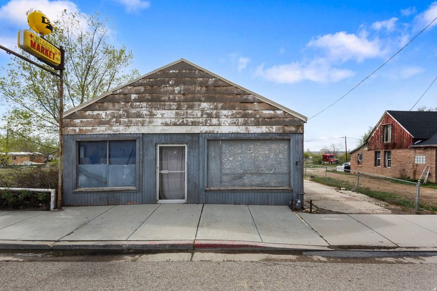 Unlock the potential of this truly unique live/work opportunity in the heart of Wellington! Zoned General Commercial and situated on nearly a third of an acre, this versatile property offers exceptional visibility and access right on Main Street (Highway 6)-the primary route connecting the Wasatch Front to Green River, Moab, and the stunning San Rafael Swell. With a high daily traffic count, this location is ideal for a business looking to capture steady exposure. The property features a 3-bedroom, 1-bath residence paired with an attached storefront space complete with a half bath and ample storage-perfect for retail, office, or service-based use. Whether you're an entrepreneur seeking a convenient live/work setup or an investor looking for income potential, this property delivers flexibility and opportunity. Positioned next door to the well-known local favorite, the Cowboy Caf, and just minutes from shopping, dining, and entertainment, the location combines small-town charm with strategic accessibility. County tax records reflect 1,094 square feet; however, the actual square footage is believed to be more than double. Buyers are advised to verify all measurements. Priced with condition in mind, this property offers tremendous upside. With vision, TLC, and effort, it can once again become a vibrant and valuable part of the community. The true value lies in the land, location, and limitless potential. Don't miss your chance to bring this property back to life and make it your own!