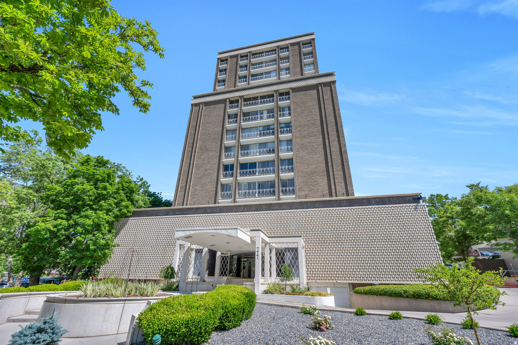 High-rise building featuring brick and concrete construction with multiple balconies