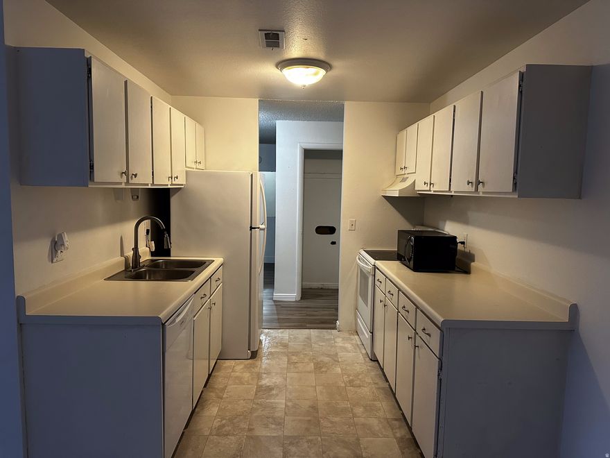 Clean, move-in ready 2-bedroom condo with fresh interior paint, newer flooring, and an updated bathroom. Comfortable, functional layout with all appliances included, plus a new kitchen faucet and smart thermostat.  HOA covers water, sewer, trash, and exterior maintenance, helping keep ownership simple and predictable.  Conveniently located near I-15 with quick access to downtown Salt Lake, the airport, parks, and local events. Easy to maintain and ready for its next owner.  Square footage figures are provided as a courtesy estimate only and were obtained from public record. Buyer is advised to obtain an independent measurement and verify all information.