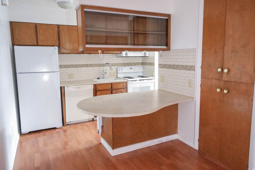 This rare and high-demand spacious 55+ condo in Bountiful offers comfortable and convenient single-level living, boasting more square footage than many other units in the area. Featuring ADA accessible hallways, doorways, and countertops, and no steps throughout, this unit provides accessibility for those with mobility considerations, both now and in the future. Recent updates include brand new carpeting in the living room and bedrooms, along with tilework, countertops, and rarely used appliances that were all new approximately 10 years ago. Enjoy relaxing views of the nearby park and Wasatch Mountains from your bedroom window and the cozy ambiance of a working brick fireplace in the living room. The condo also features a large, in-unit storage room for easy access to belongings, and a second bedroom with its own entrance, perfect for a caregiver or visiting family. Natural daylight floods the unit through two skylights, creating a bright and cheerful atmosphere. Located in a quiet community with good neighbors and walking paths, this unit is also conveniently situated near its two covered parking spaces, the swimming pool, and essential amenities like a grocery store, restaurants, the post office, and Downtown Bountiful. As a bonus, the seller is offering a 1-year home warranty with the purchase. Buyer to verify all.