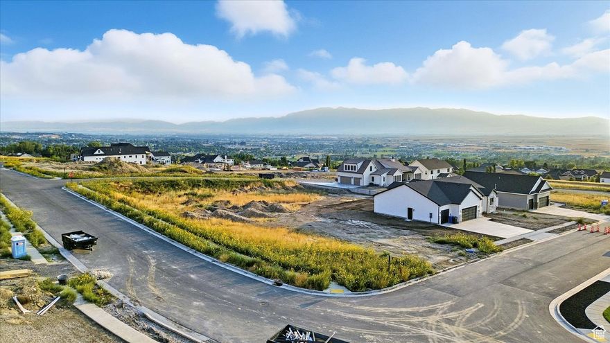 This .29-acre East Bench lot #17 offers some of the valley's most breathtaking views and the perfect setting for your dream home. With an ideal size for flexible design, the property allows for the potential of a walkout basement and minimal excavation, streamlining your build process.  Seize the opportunity to create a custom retreat in Hyde Park's most desirable new community-welcome home to Cedar Bluffs.